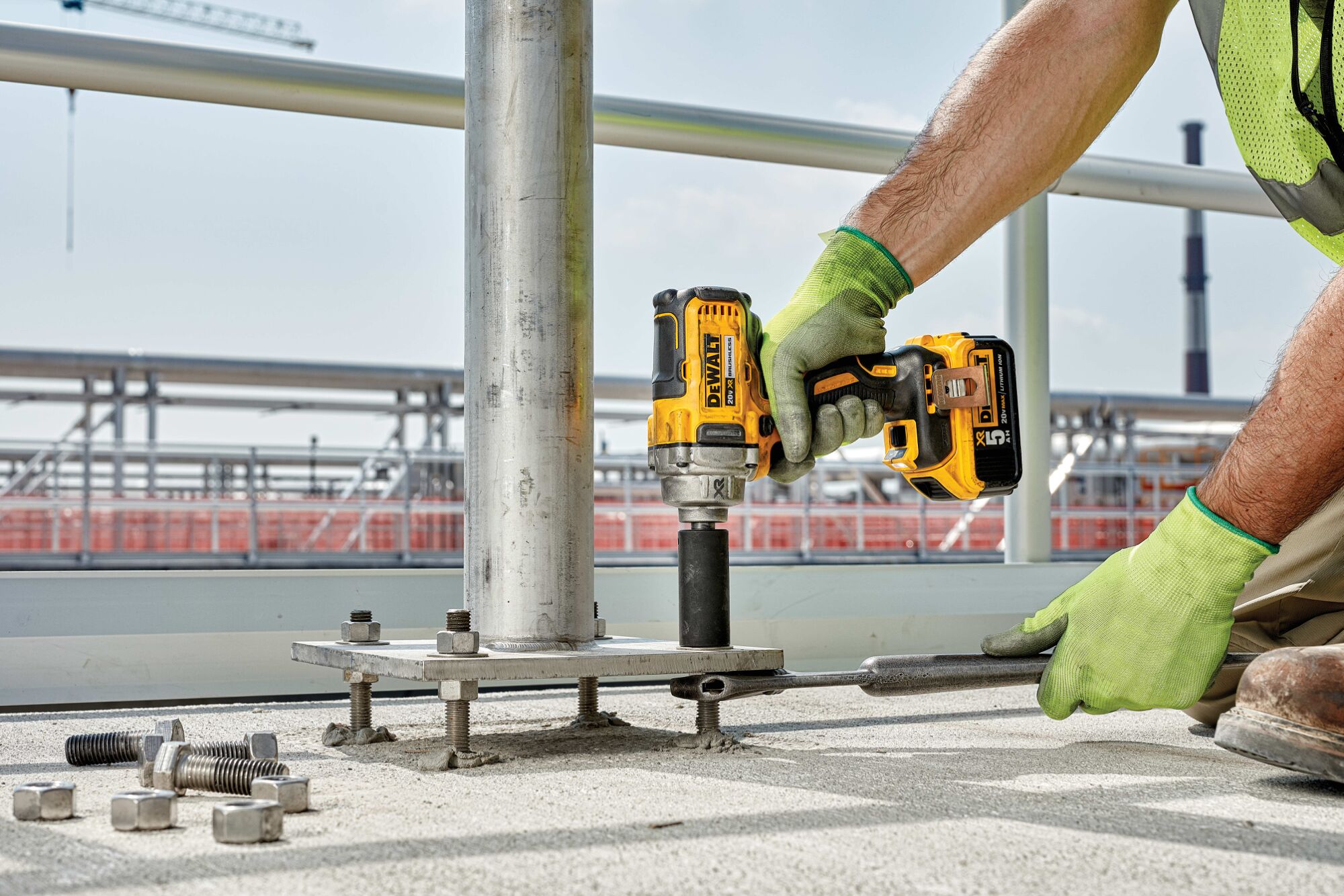 CORDLESS IMPACT WRENCH WITH DETENT PIN ANVIL being used on a work site
